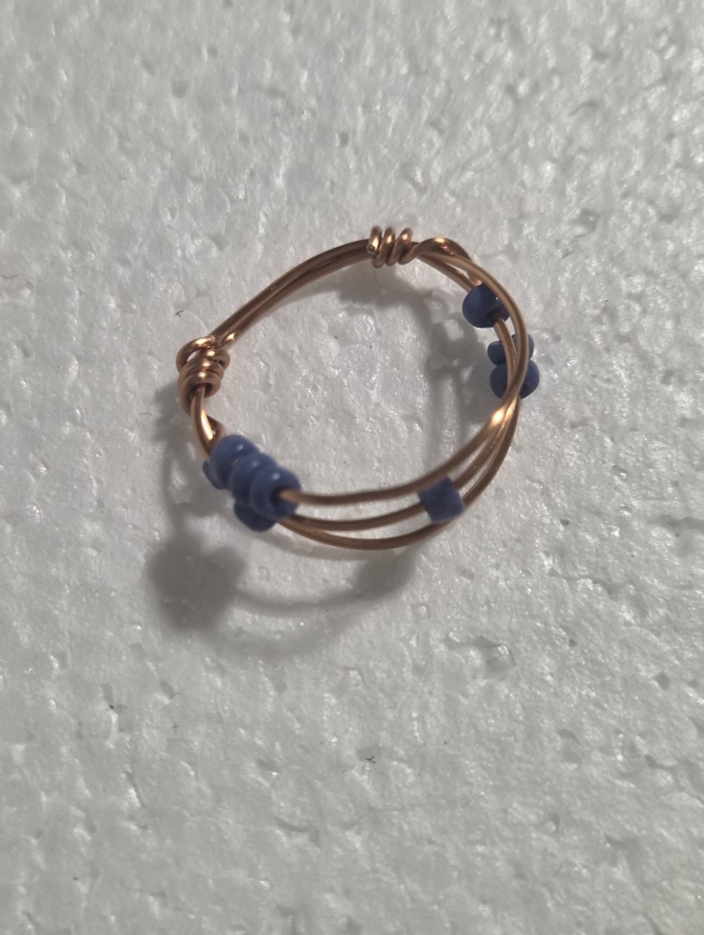 Handcrafted Copper Wire Ring with Blue Bead Accents